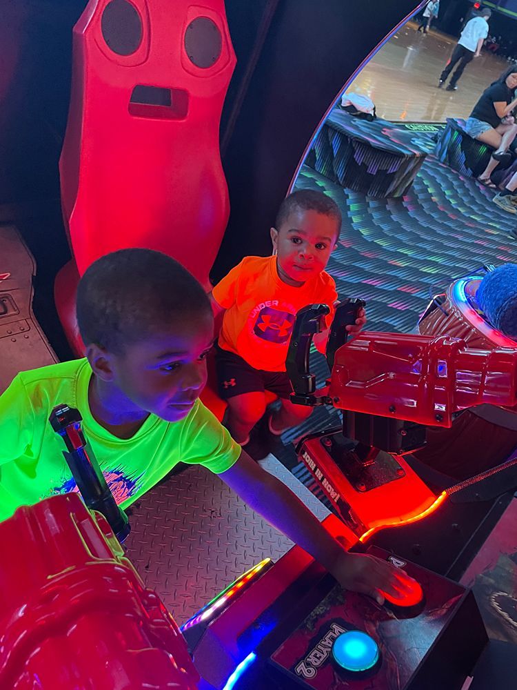 kids playing arcade games on a field trip